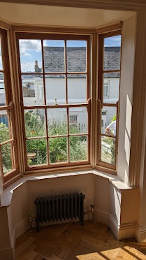 Expert hands working on detailed period joinery